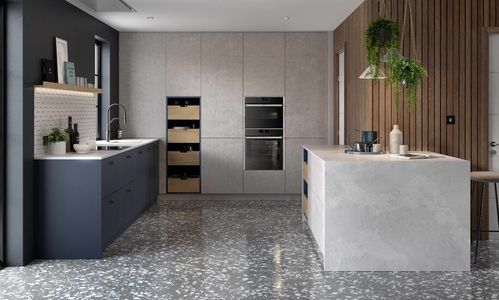Image of the Porter kitchen design by Second Nature. It’s a modern and handleless kitchen that utilises a range of natural materials, including granite, marble and wood.
