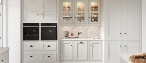 An image showcasing traditional white kitchen units with integrated kitchen appliances.