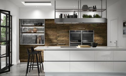 Image of a white modern kitchen design with a balance of wooden kitchen units and a gloss white kitchen island.