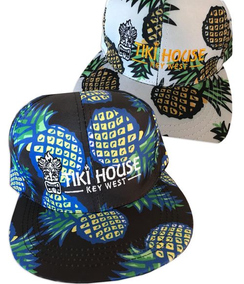 brimmed caps with pineapple pattern in black and white with tiki house key west logo embroidered.