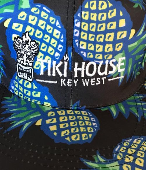 brimmed caps with pineapple pattern in black with tiki house key west logo embroidered.