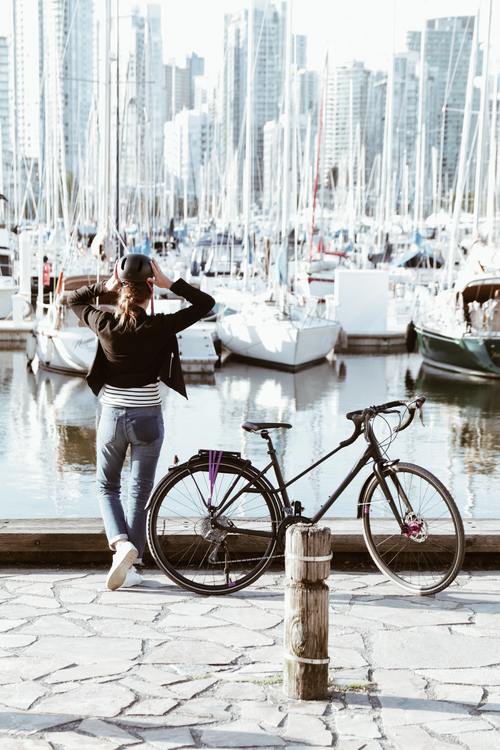 Girl Riding Bike On Vancouver Seawall.