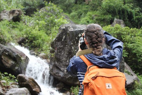 YWAM Vancouver Staff Talking Photo Of Waterfall.
