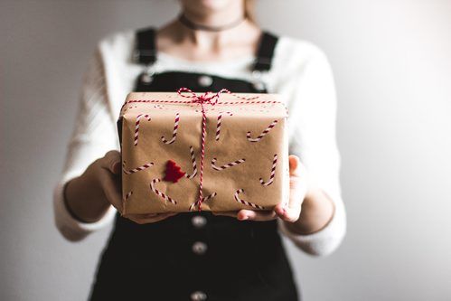 Girl Holding Christmas Gift.