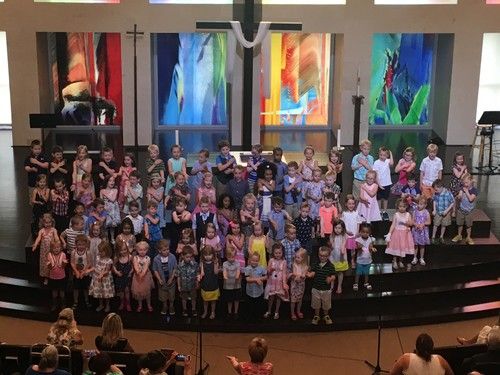 Children singing during worship