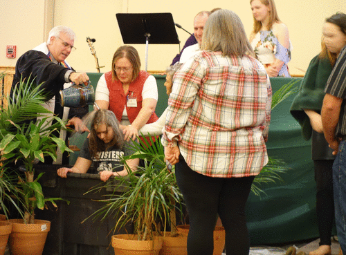 Pastor Hoyt baptizing a youth