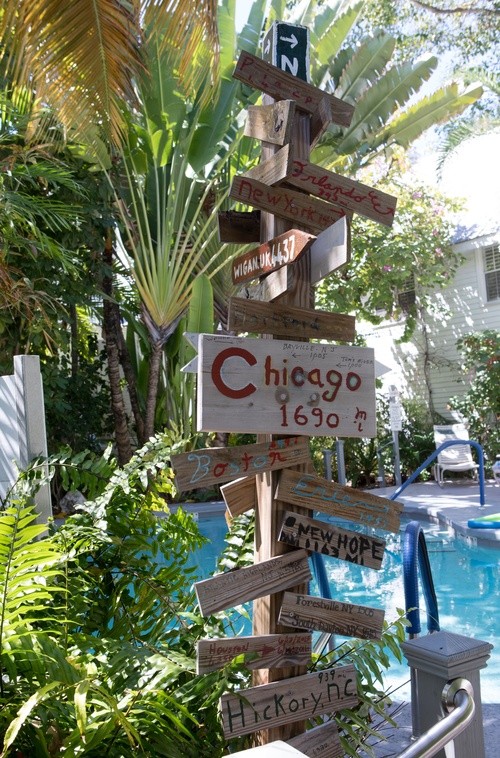 directional signage point to major cities located near the pool at The Banyan Resort