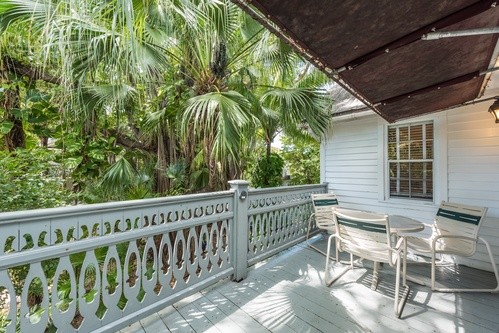 lush, tropical view from a balcony of suite at The Banyan Resort